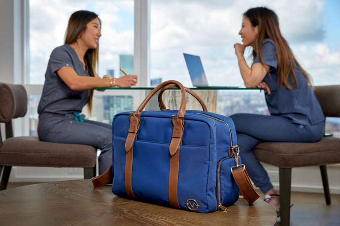 Doctor and dentist bag with two female healthcare professionals in background